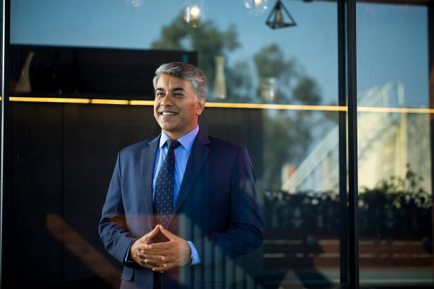 Businessman smiling with his hands clasped