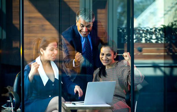 istock Business people celebrating online success using laptop 1462434205