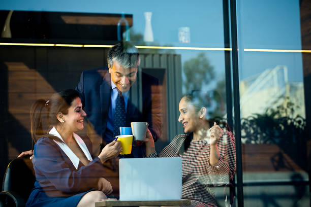 istock Business people enjoying a celebratory toast with coffee cups 1462434265
