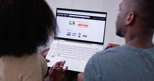 istock Young Couple Shopping Online On Laptop 1462446231