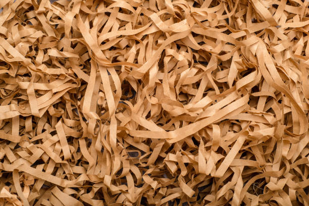 istock Shredded craft paper in the foreground. Texture. 1462446460