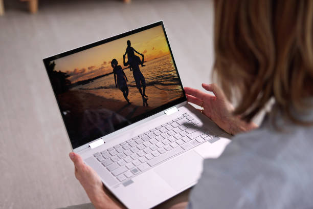 istock Watching TV Video On Laptop Online 1462447674