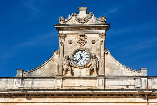 istock Clock with statues on a building in Castellaneta 1462471142