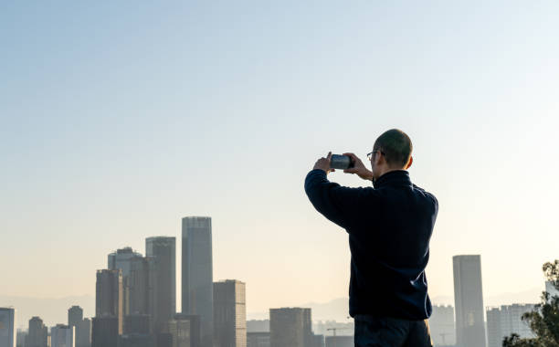 istock City man taking pictures with mobile phone 1462471973