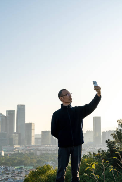 istock City man taking selfie with mobile phone 1462472191
