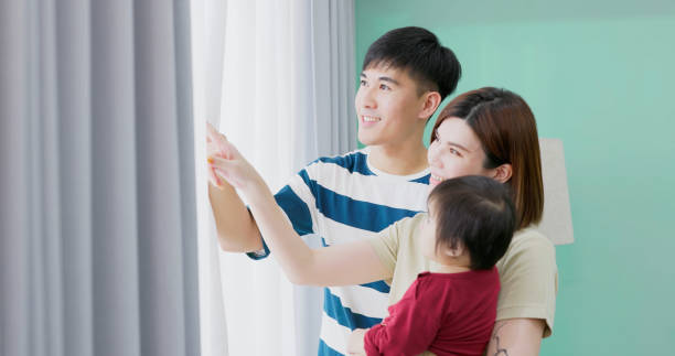 istock asian family by window 1462473331