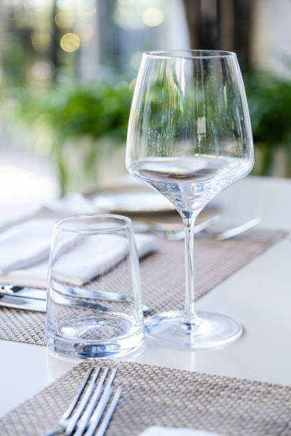 istock Restaurant table with wine glasses and napkins 1462500937