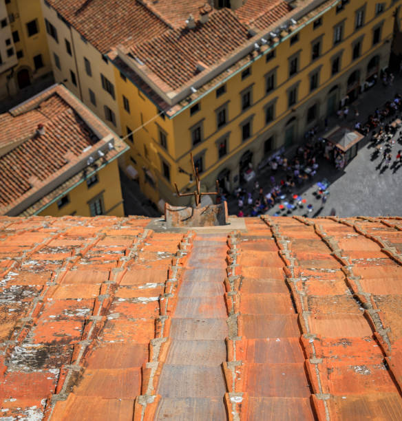 Red terracotta rooftops of the Duomo Cathedral Brunelleschi dome, Florence Italy Aerial view of the red terracotta rooftops of the Brunelleschi dome of Duomo Cathedral or Cattedrale di Santa Maria del Fiore in Florence, Italy filippo brunelleschi stock pictures, royalty-free photos & images