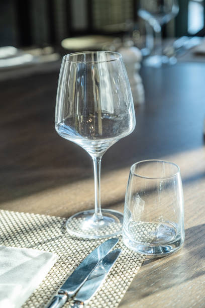 istock Restaurant table with wine glasses and napkins 1462503073