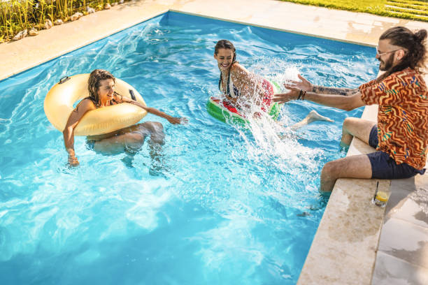 istock Friends enjoying day at poolside 1462505214
