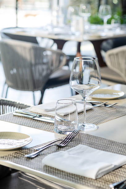 istock Restaurant table with wine glasses and napkins 1462505761