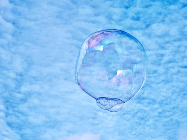 istock Close-Up Of Bubbles Against Blue Sky 1462508358