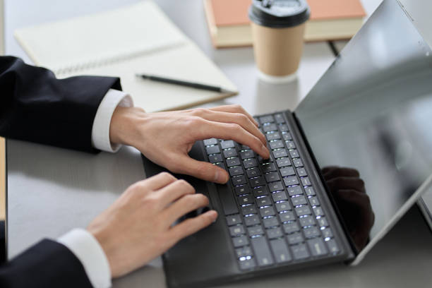 istock Asian businessman typing on laptop 1462512417