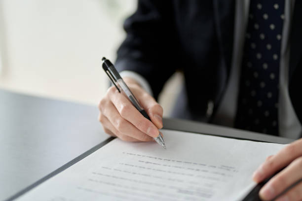 istock Asian businessman signing a contract 1462512478