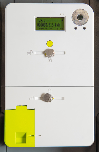 Close-up of digital smart meter, a device for household meter readings, measurement of electricity consumption and injection of self-generated energy.