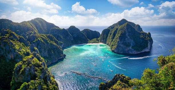 Aerial view of the famous Maya Beach, Phi Phi islands Aerial view of the famous Maya Beach, Phi Phi islands, Thailand, with turquoise sea shining between the lush mountains phi phi islands stock pictures, royalty-free photos & images