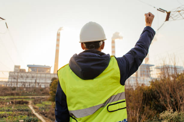 istock Engineers working in the power plant raise their hands and work with confidence 1462521794