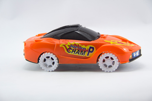 close up of a children's toy car on a white background
