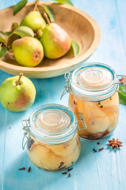 istock Pickled pears with anise and sugar in jar. 1462528471