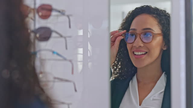 Mirror, woman and shopping for glasses, eye care and consultation for clear vision, healthcare or optometry. Female, lady with reflection or eyewear for sight, checkup and customer in store or retail