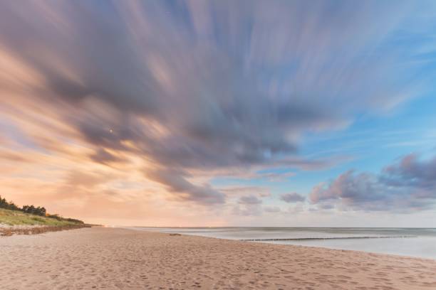istock Beautiful shot of a sandy beach under a cloudy sky during a sunset 1462533576