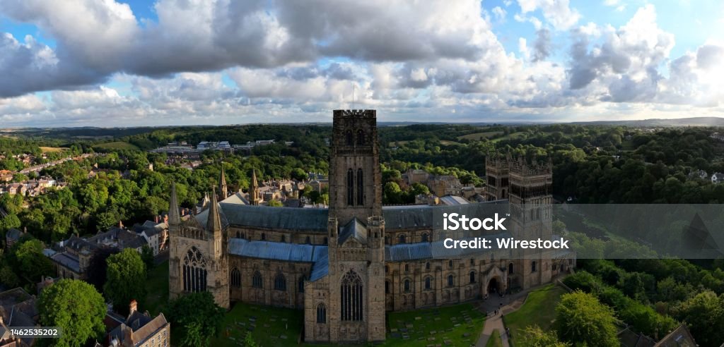 Aerial panoramic view of Durham Cathedral surrounded by lush green vegetation in Durham, England An aerial panoramic view of Durham Cathedral surrounded by lush green vegetation in Durham, England Architecture Stock Photo