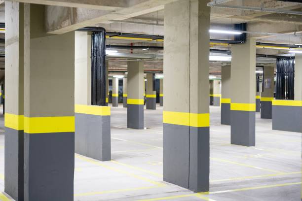 istock New spacious parking lot with symmetric pillars 1462535947