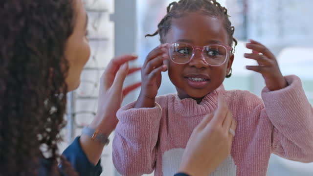 Child, optician and glasses in optics store for choice of lens or frame with customer healthcare insurance. Optometrist service person and happy black girl excited in vision, eye care and retail shop