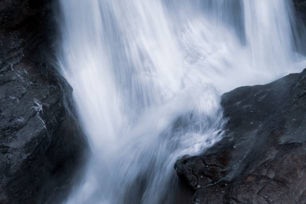 istock Long-exposure shot of a waterfall cascading down the rocks in Austria 1462545366