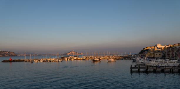 istock Quiet evening at a yacht harbour with calm and smooth water illuminated by the setting sun 1462546683