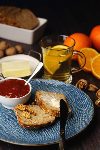 Rustic and healthy breakfast flat laybowl of raw oats, coffee, and toasted bread slices on a wood and fabric background. Cozy, natural, and perfect for morning energy concepts
