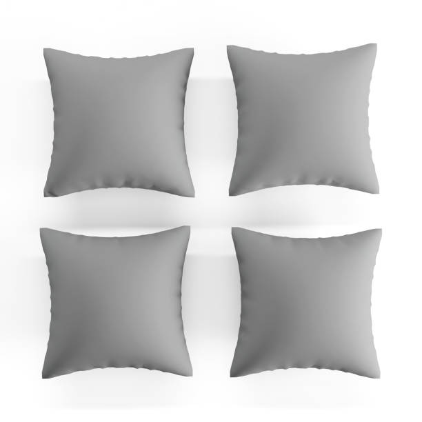 istock Closeup of four grey pillows on a white background. 1462549704