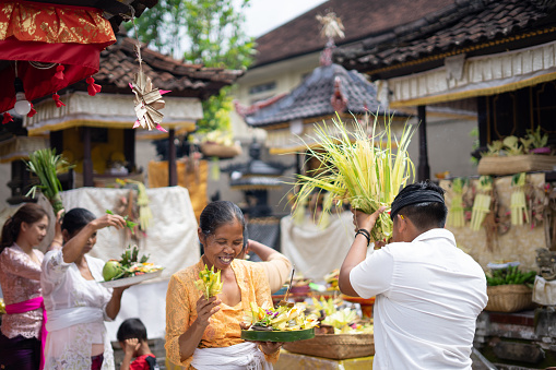Balinese people having hindu religion ceremony , preparation before Mebayuh & Otonan