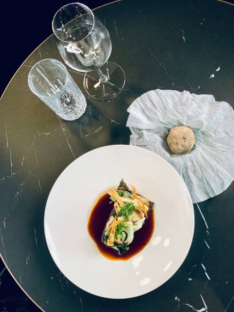 istock fine dining in a modern setting with a marble and wooden background. exquisite products. 1462550716