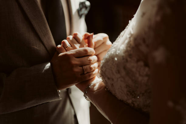 istock Bride and groom holding hands 1462552586