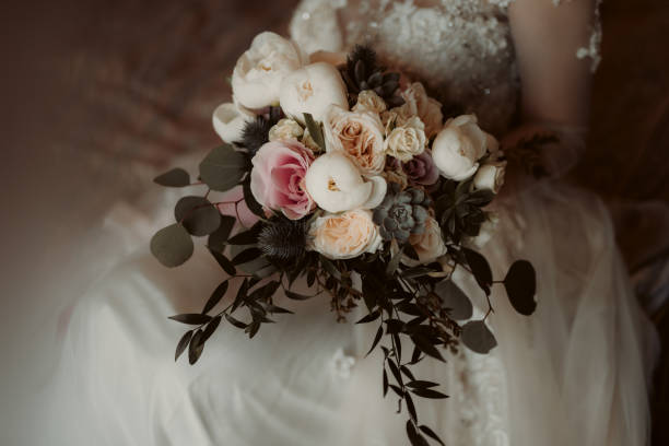 istock Selective focus shot of a bouquet in bride's hands 1462552649