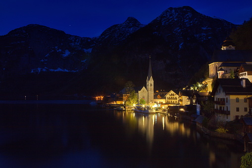 A classical night view of beautiful Alpine Hallstatt Town and lake, Austria
