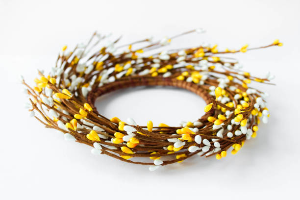 istock Minimal Easter composition with place for text. Concept of creative arrangement made of blossoming twigs. Handcraft Easter wreath made from twigs isolated on white background 1462553435