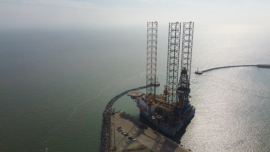 Offshore Oil rig at Great Yarmouth UK waiting to be decomissioned 
aerial drone view