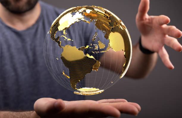 istock Businessman holding a floating render of a globe outline- global network connection concept 1462561145