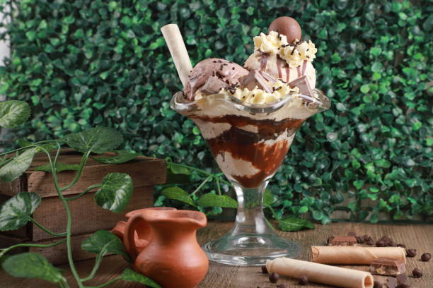 istock Ice cream with chocolate on a wooden table 1462562413