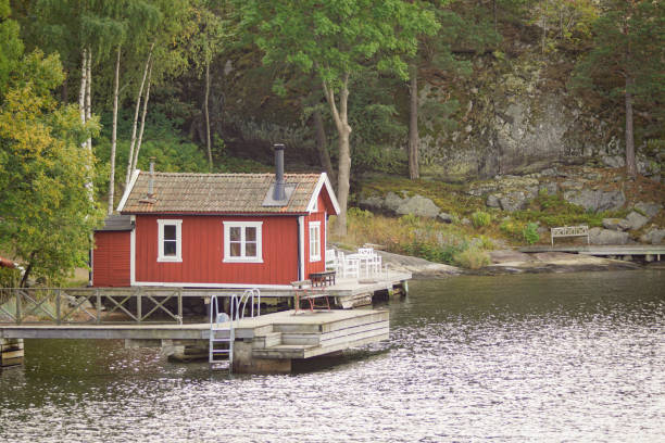 istock View of a small red building at the beach 1462563135