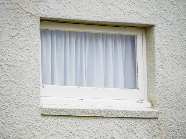 istock white wooden awning basement windows with white curtain 1462563853