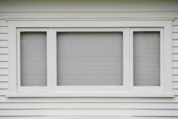 istock typical white wooden window on weatherboard wall 1462563855