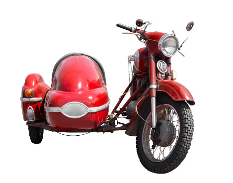 Old red motorcycle with a sidecar. Isolated on white background