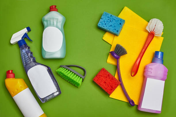 istock Detergents and cleaning accessories on a green background. Housekeeping concept. 1462607614