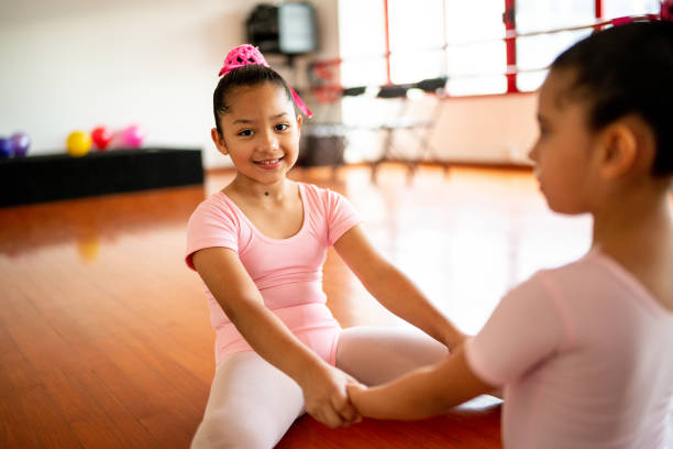 istock Portrait of ballet dancers stretching during a class at the dance studio 1462611819