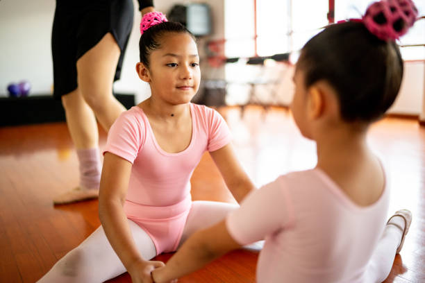 istock Ballet dancers stretching during a class at the dance studio 1462612415