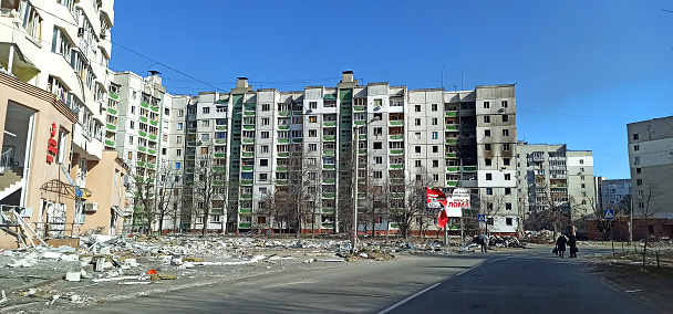 Chernihiv - Ukraine. 25 March 2022: Destruction of multi-storey building after being hit by artillery shell. Street with destroyed high-rise buildings in Ukraine during the war. Russia full-scale invasion of Ukraine