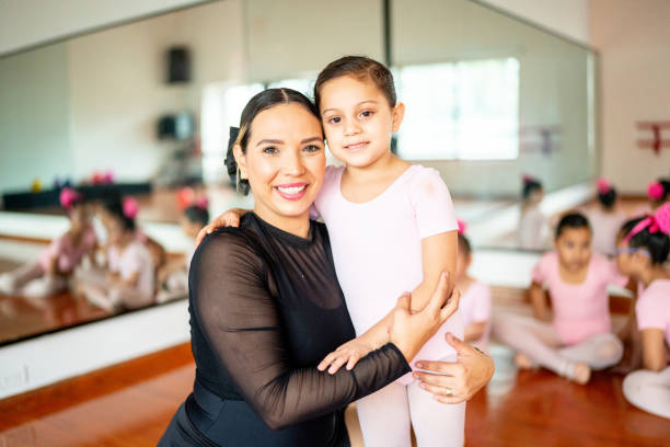 istock Portrait of ballet instructor with student at the ballet studio 1462613326